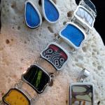 Real butterfly wings, incased in glass and framed with sterling silver. Pendants, earrings, rings and bracelets